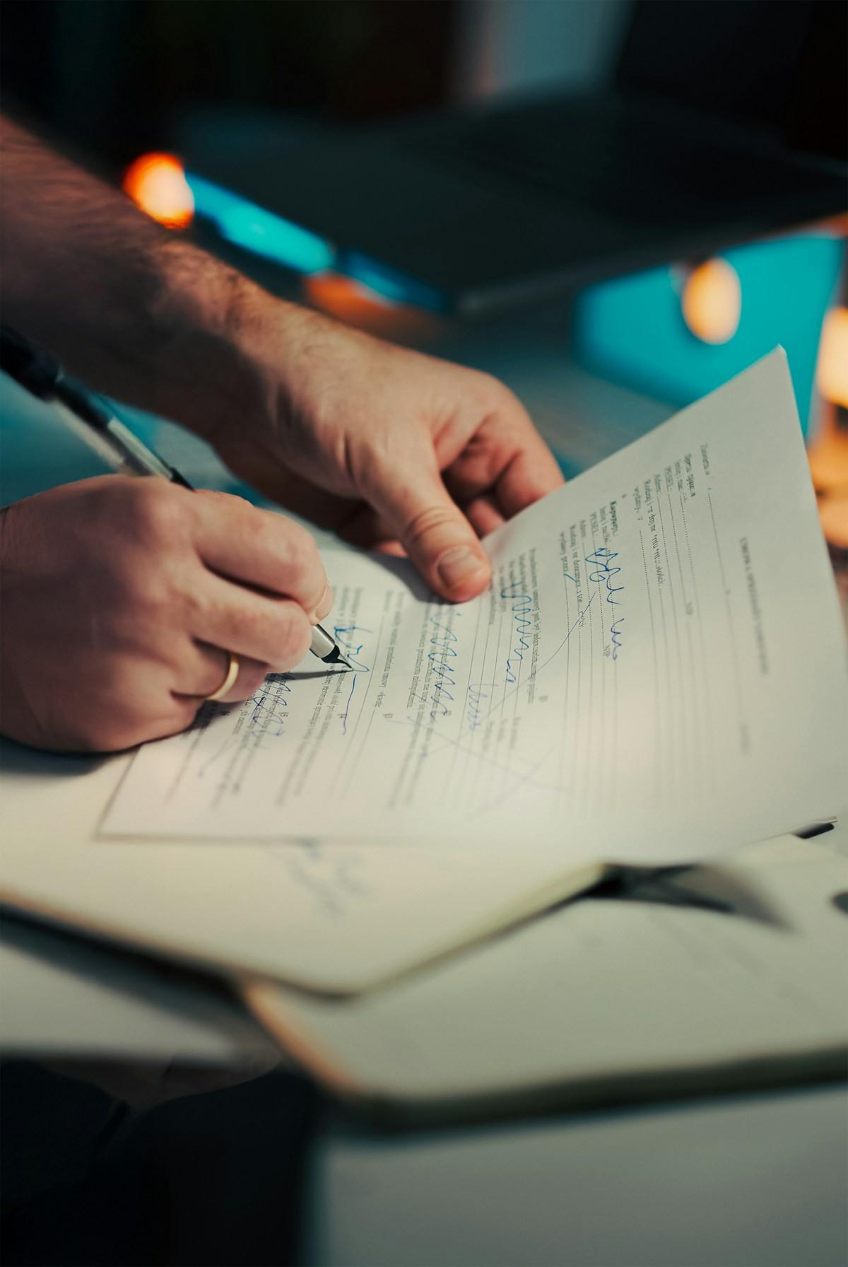 A document being signed with a pen