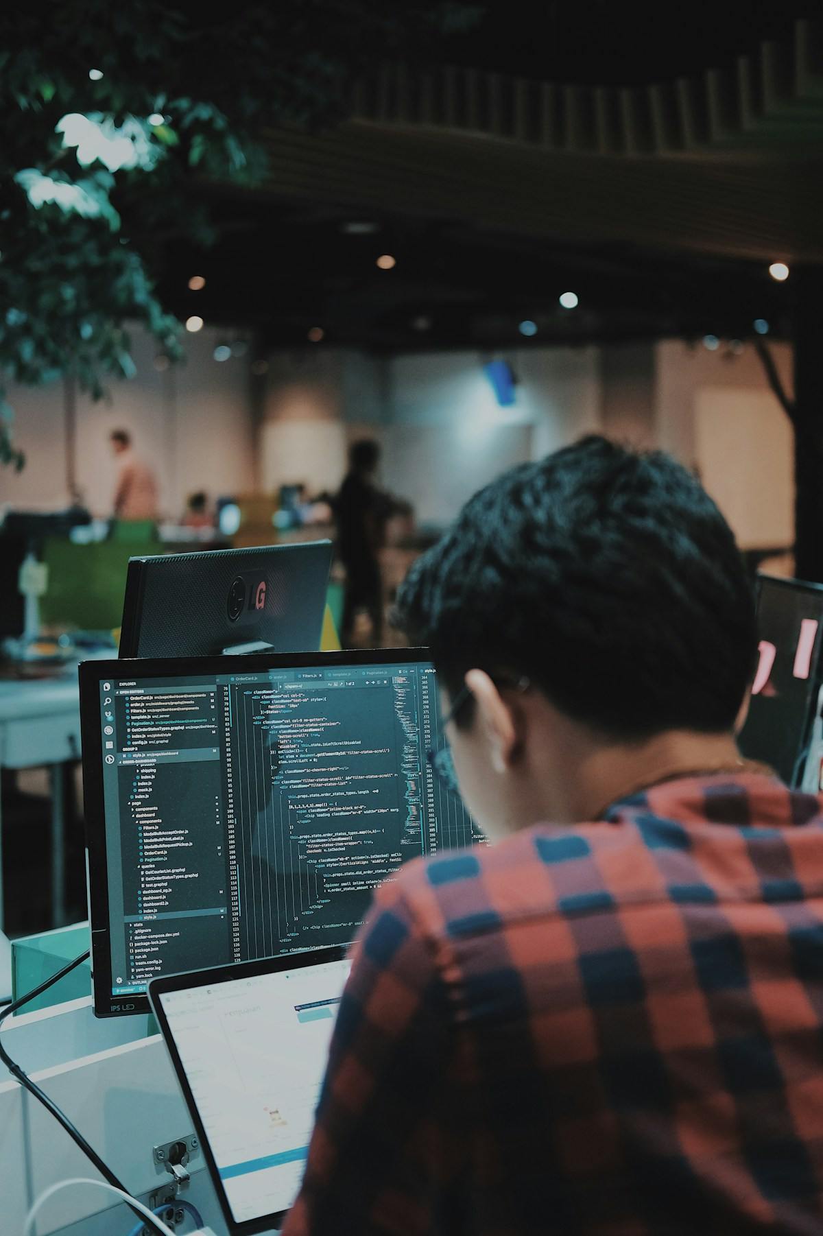 Engineer writing code at a workstation
