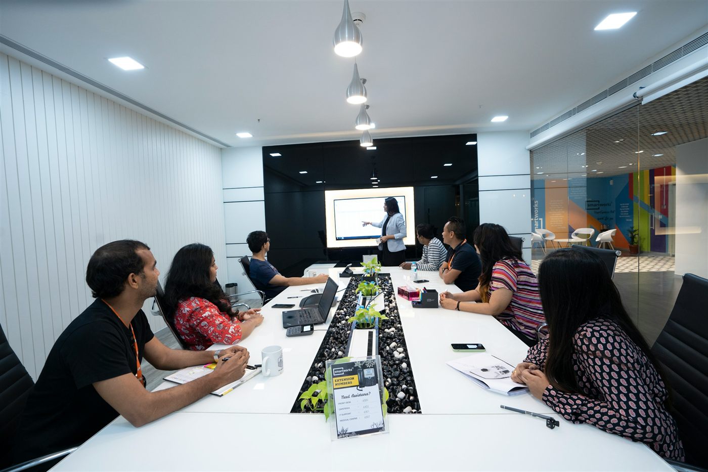 Indian leadership team in a boardroom reviewing a presentation